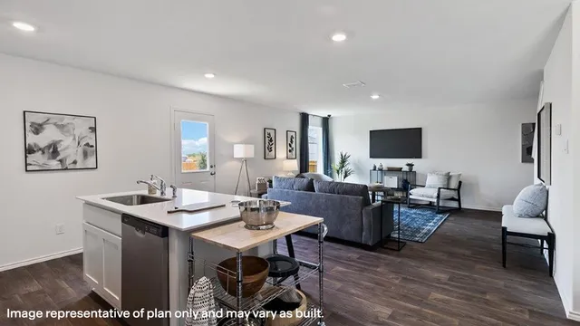 a view of a livingroom with furniture and a flat screen tv