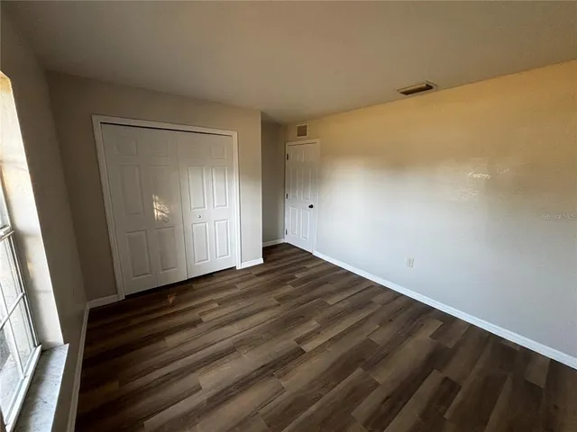 a bathroom with a sink a toilet a mirror and shower