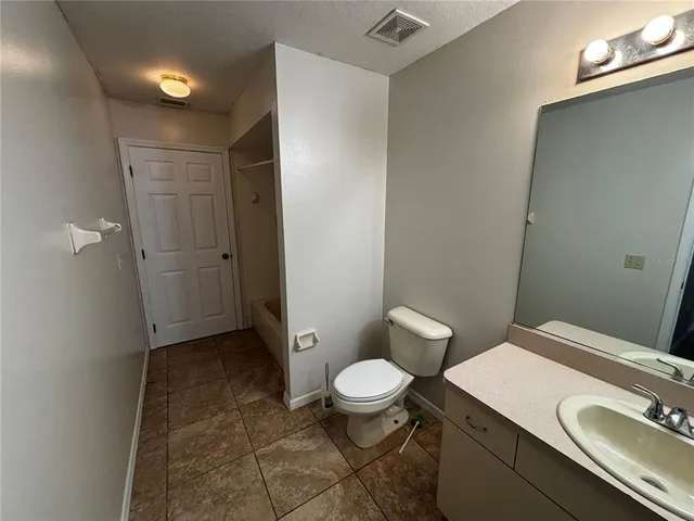 a view of room with window and wooden floor