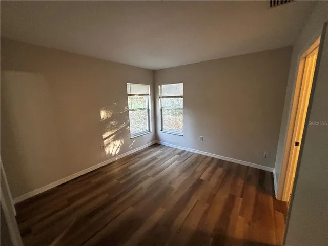 a bathroom with a sink mirror vanity and toilet
