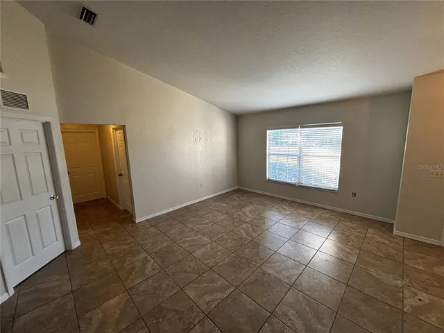 a view of an empty room and window