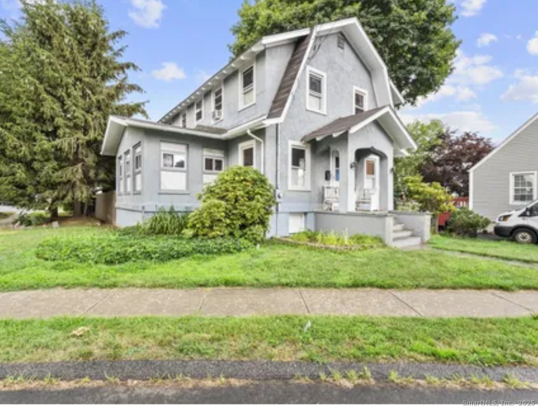 1276 North Avenue Stratford, CT 06614 - Photo 1 of 10 a front view of a house with a yard