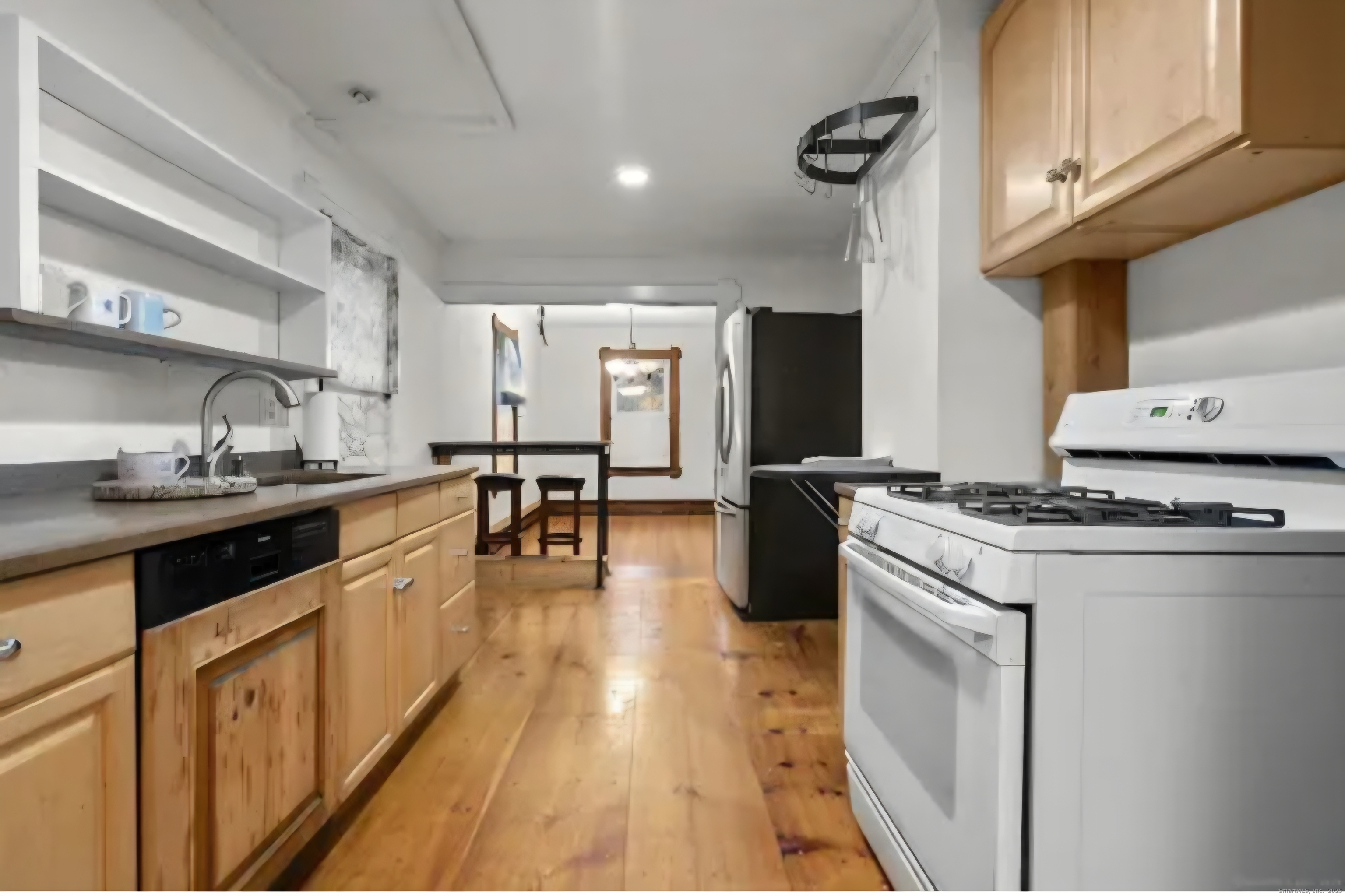 1276 North Avenue Stratford, CT 06614 - Photo 2 of 10 a kitchen with stainless steel appliances granite countertop a stove a sink dishwasher and a refrigerator