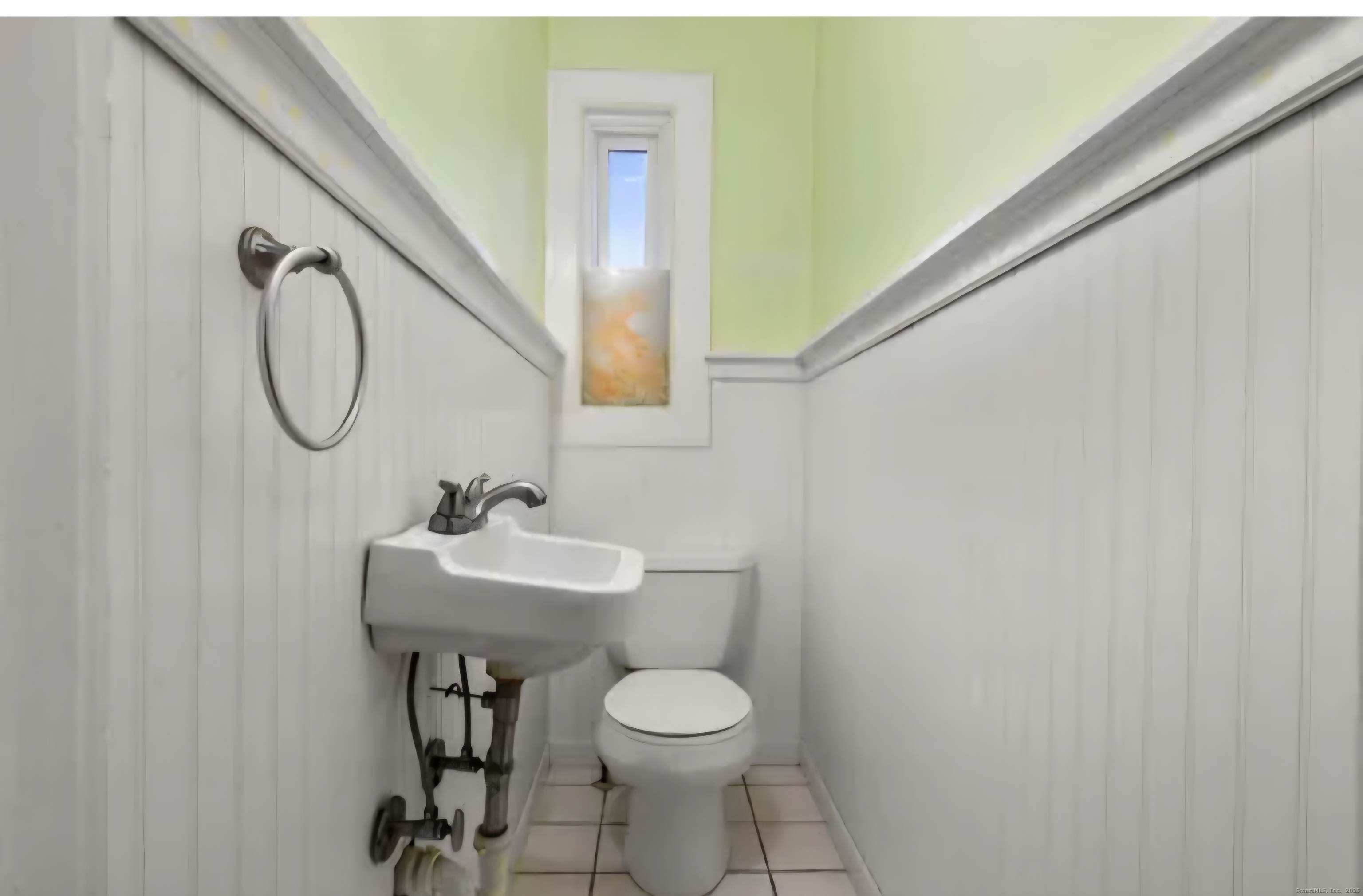 1276 North Avenue Stratford, CT 06614 - Photo 6 of 10 a bathroom with a sink toilet and a mirror