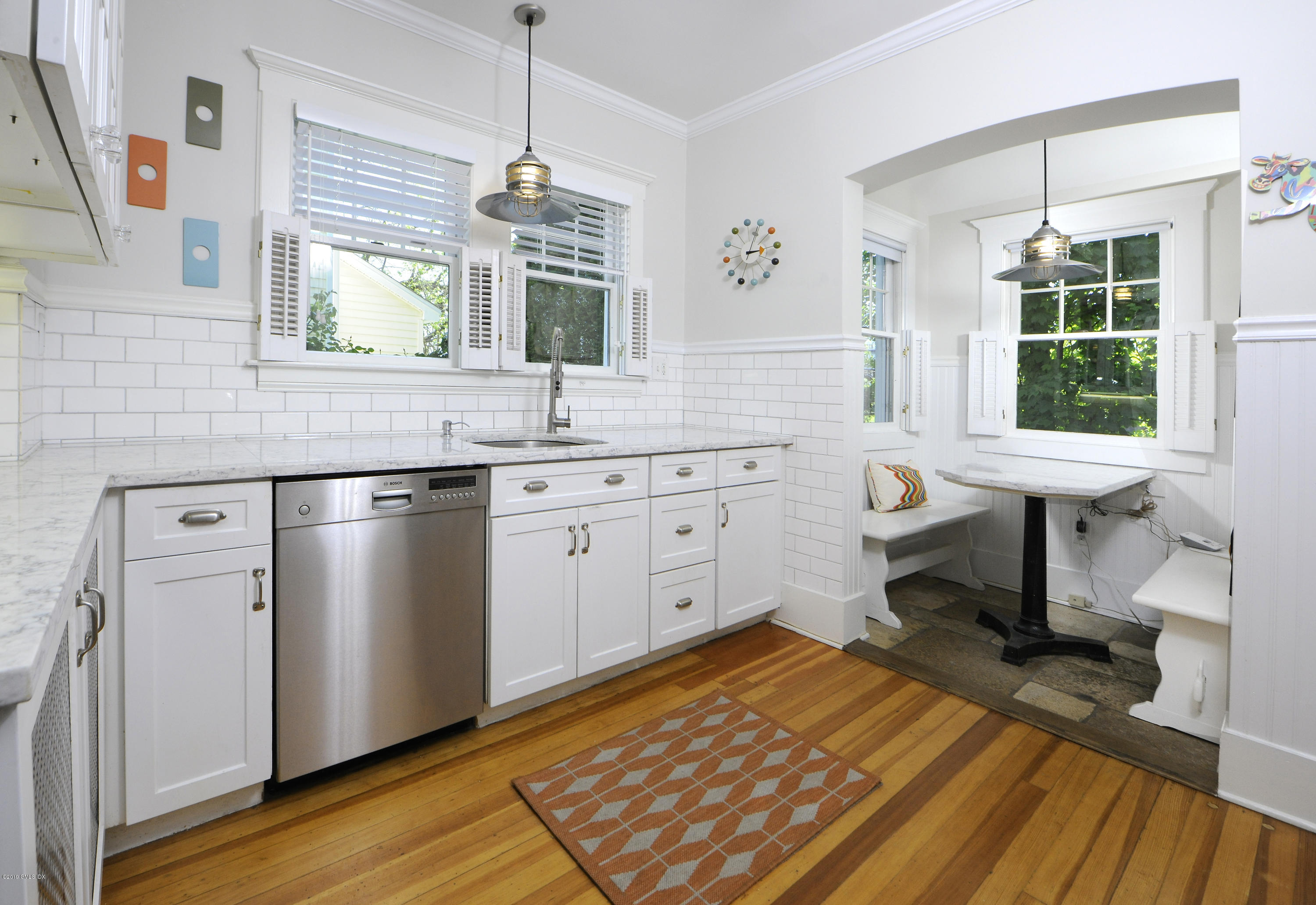 5 Sound View Court Greenwich, CT 06830 - Photo 8 of 13 a kitchen with a sink cabinets appliances and a window
