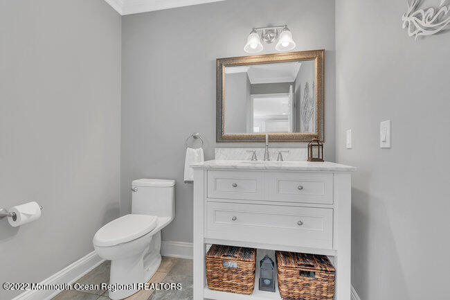 63 Fort Avenue Seaside Heights, NJ 08751 - Photo 16 of 53 a bathroom with a sink toilet and mirror