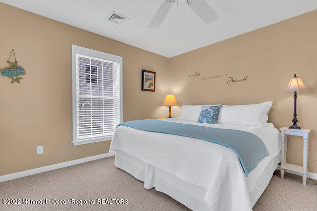 63 Fort Avenue Seaside Heights, NJ 08751 - Photo 19 of 53 a bedroom with a bed and a window