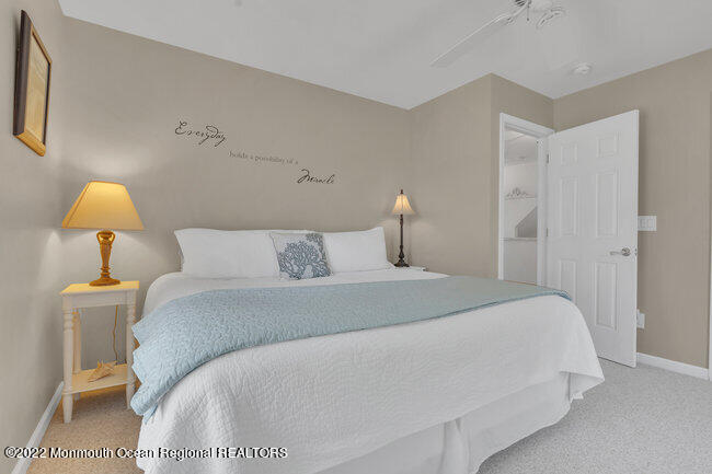 63 Fort Avenue Seaside Heights, NJ 08751 - Photo 20 of 53 a bedroom with a bed and a lamp