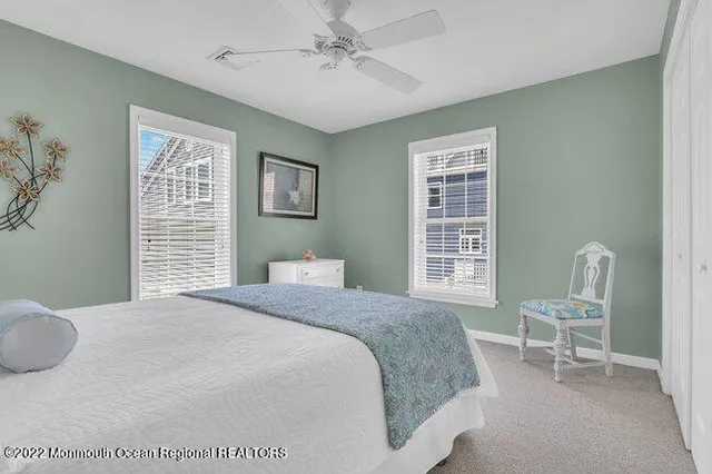 a bedroom with a bed and chair