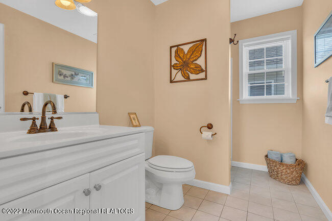 63 Fort Avenue Seaside Heights, NJ 08751 - Photo 24 of 53 a bathroom with a toilet sink and mirror