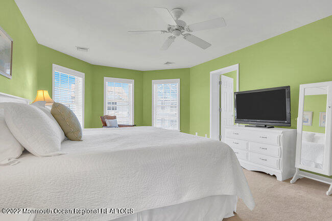 63 Fort Avenue Seaside Heights, NJ 08751 - Photo 25 of 53 a bedroom with a bed and a flat screen tv