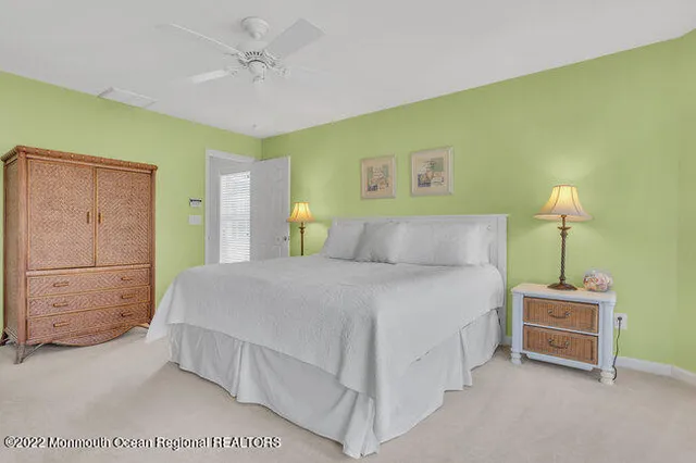 a bedroom with a bed and a table