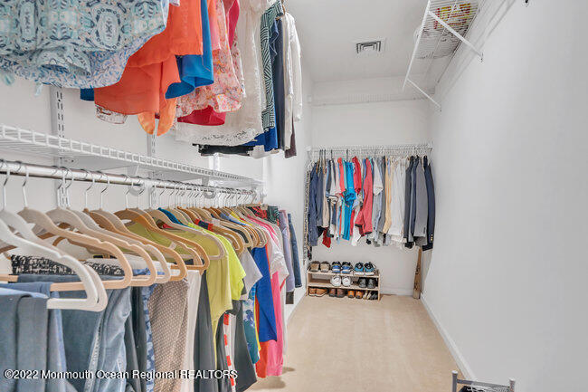 63 Fort Avenue Seaside Heights, NJ 08751 - Photo 28 of 53 a view of walk in closet with clothes and shoes