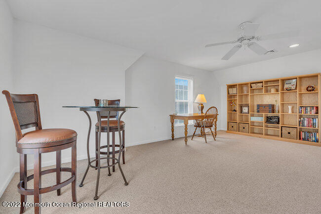 63 Fort Avenue Seaside Heights, NJ 08751 - Photo 31 of 53 a living room with furniture and a fireplace