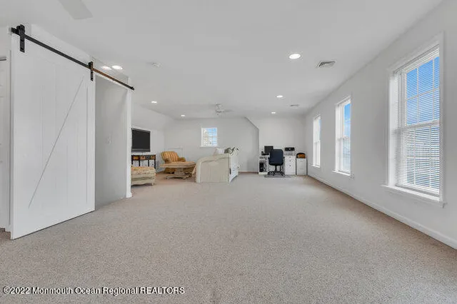 a view of work space with furniture and a chandelier