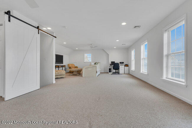 63 Fort Avenue Seaside Heights, NJ 08751 - Photo 32 of 53 a living room with furniture and a large window