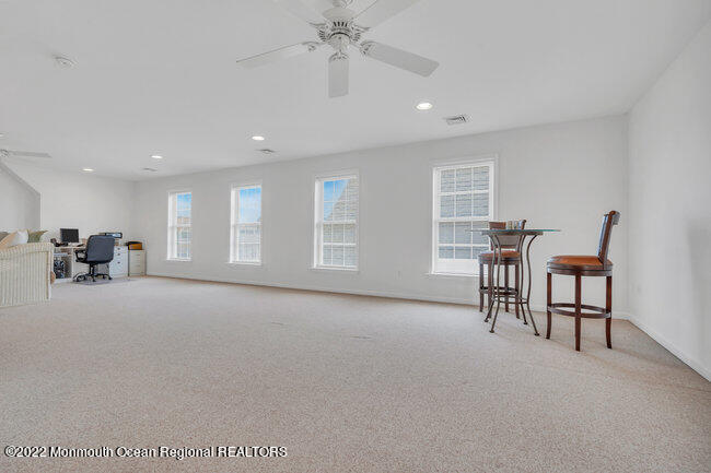 63 Fort Avenue Seaside Heights, NJ 08751 - Photo 33 of 53 a view of work space with furniture and a chandelier