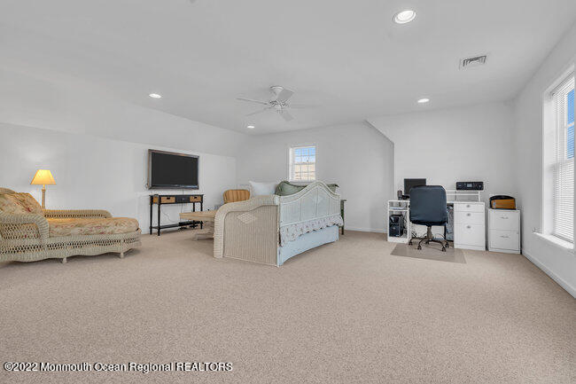 63 Fort Avenue Seaside Heights, NJ 08751 - Photo 34 of 53 a living room with furniture and a flat screen tv
