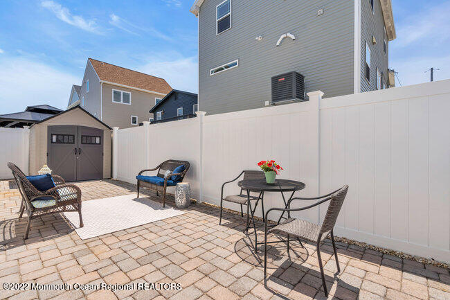 63 Fort Avenue Seaside Heights, NJ 08751 - Photo 41 of 53 a view of a chairs and tables
