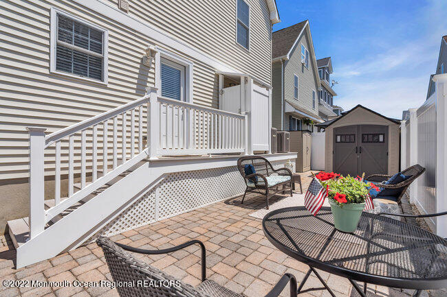 63 Fort Avenue Seaside Heights, NJ 08751 - Photo 42 of 53 a outdoor space with lots of chairs and a couch