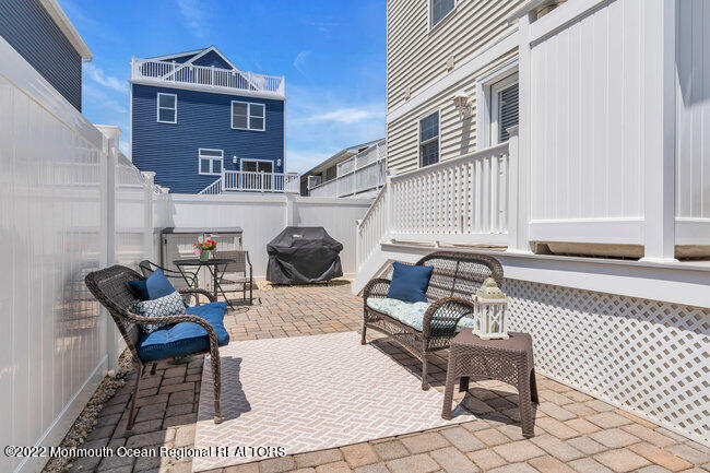 63 Fort Avenue Seaside Heights, NJ 08751 - Photo 43 of 53 a building outdoor space with patio furniture
