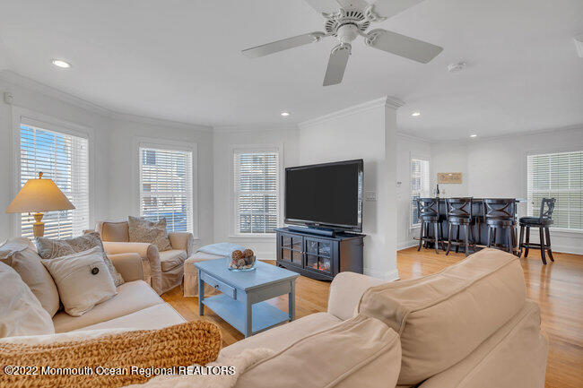 63 Fort Avenue Seaside Heights, NJ 08751 - Photo 7 of 53 a living room with furniture and a flat screen tv