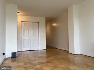 an empty room with wooden door