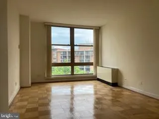 a view of an empty room with a window