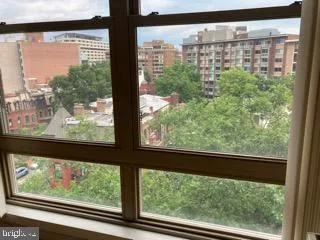a view of a glass door with a yard from a window
