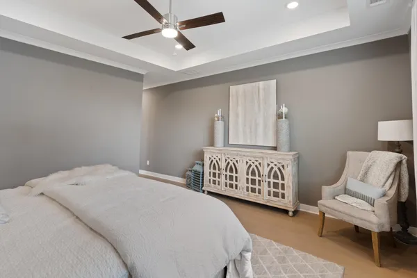 a bedroom with a bed and couch