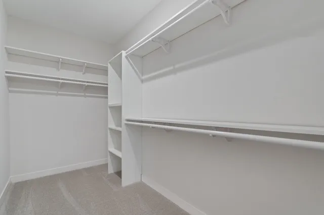 a view of an empty walk in closet