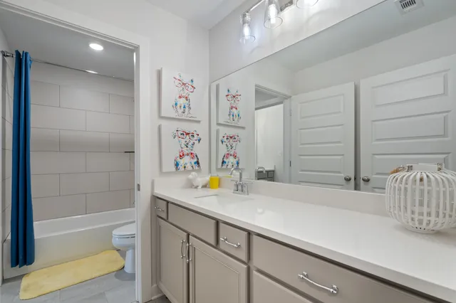 a bathroom with a sink a bathtub and a shower