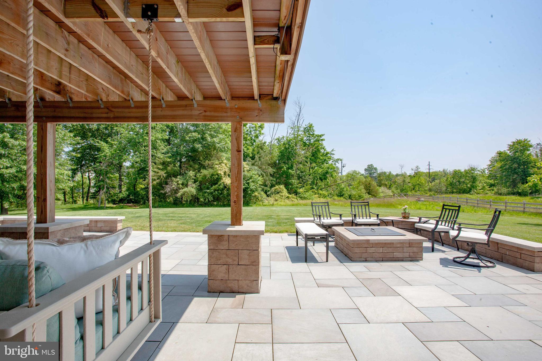 126 Pixie Moss Road Pottstown, PA 19464 - Photo 26 of 29 Blue stone patio with sitting wall and fire pit