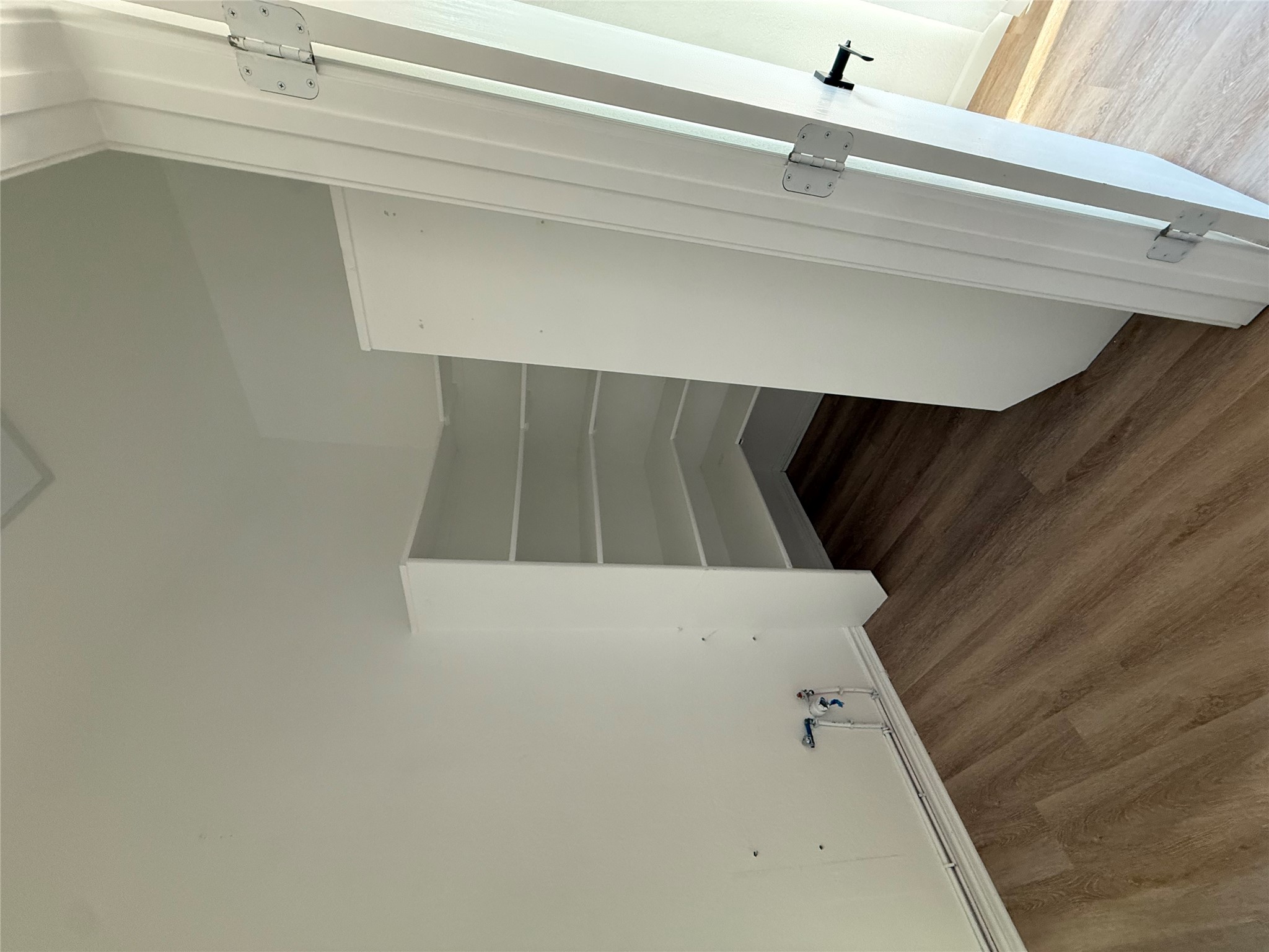9204 Magna Carta Loop Austin, TX 78754 - Photo 15 of 27 a view of walk in closet with empty racks