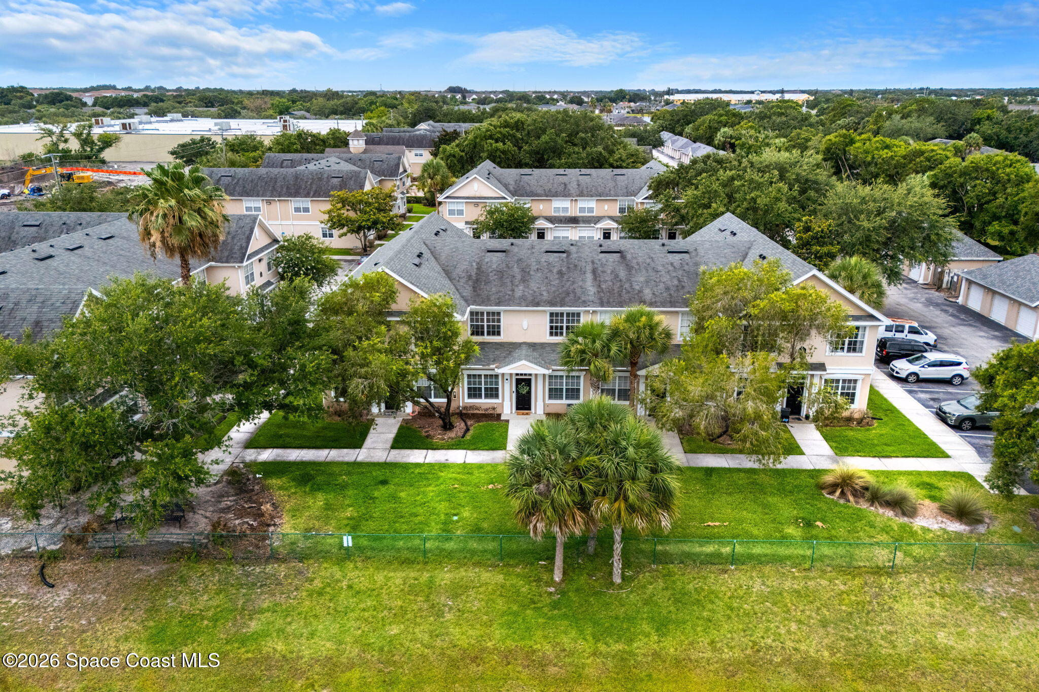 110 Turpial Way, Unit 106 Melbourne, FL 32901 - Photo 38 of 50 an aerial view of residential houses with outdoor space and swimming pool