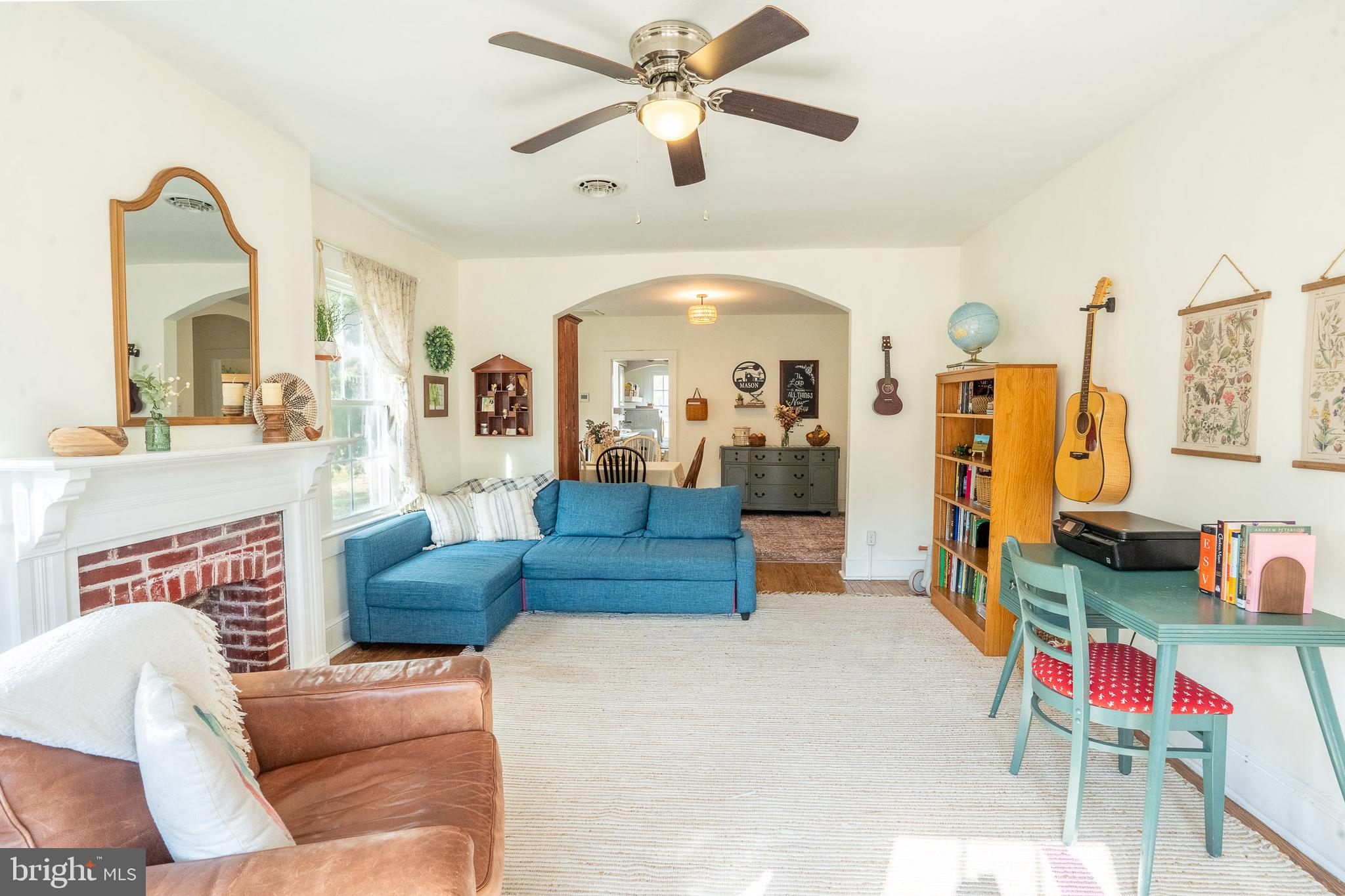 27209 Saxis Road Temperanceville, VA 23442 - Photo 13 of 31 a living room with furniture and a large window