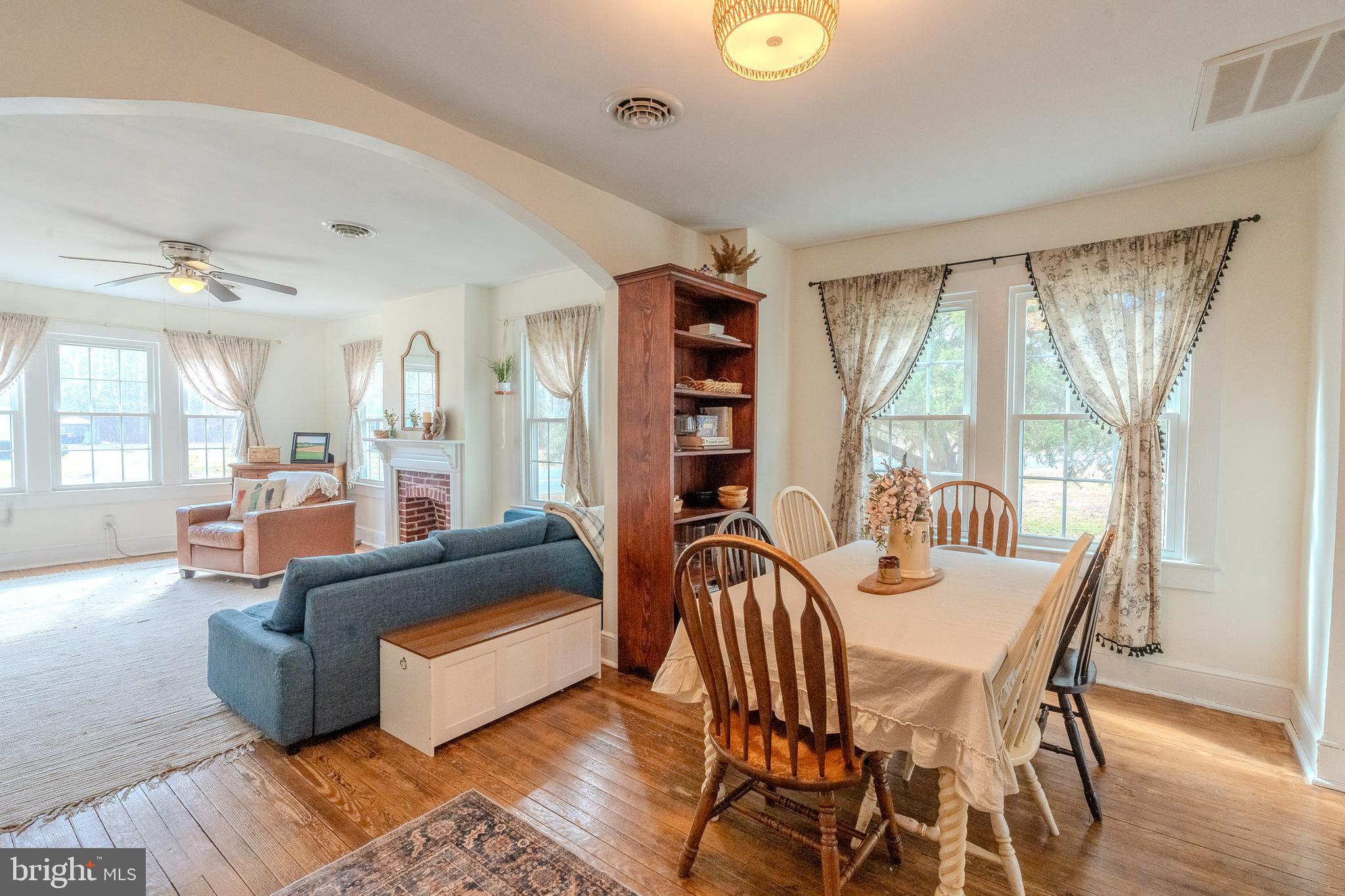 27209 Saxis Road Temperanceville, VA 23442 - Photo 17 of 31 a living room with furniture and a large window