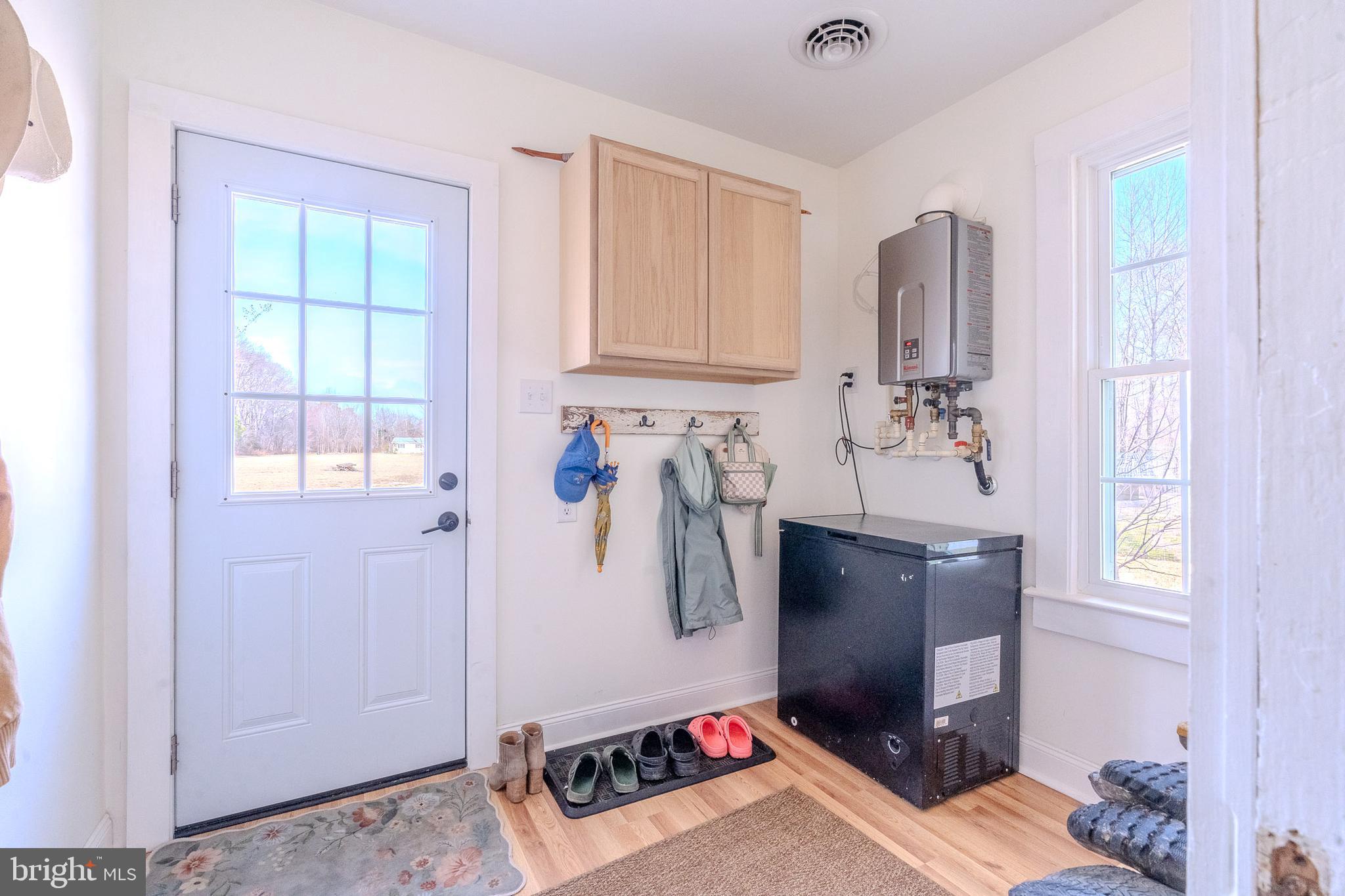 27209 Saxis Road Temperanceville, VA 23442 - Photo 22 of 31 a room with furniture a flat screen tv and a window