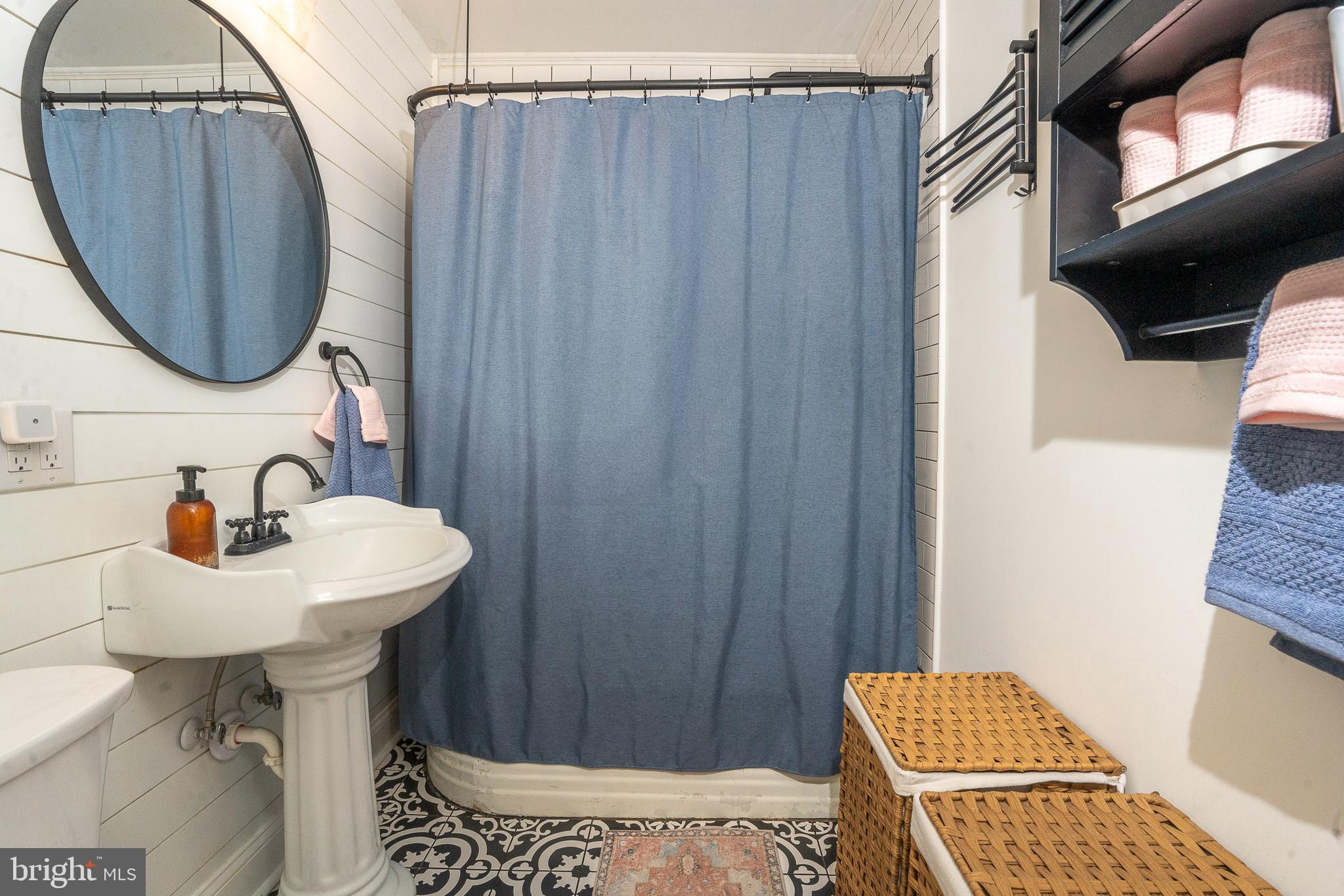 27209 Saxis Road Temperanceville, VA 23442 - Photo 25 of 31 a bathroom with a sink toilet and mirror