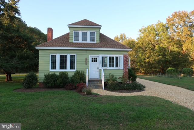 27209 Saxis Road Temperanceville, VA 23442 - Photo 3 of 31 a front view of a house with a yard
