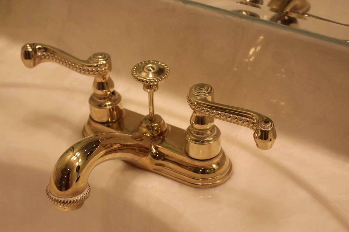 7405 Fontana Ridge Lane Raleigh, NC 27613 - Photo 23 of 25 Designer faucets, hardware and plumbing Aristokraft Landen square style, adult height maple vanity with cultured marble top - 1st floor powder room with ornate hardware, fixtures, lighting, painting and molding Cultured marble vanity tops Bath