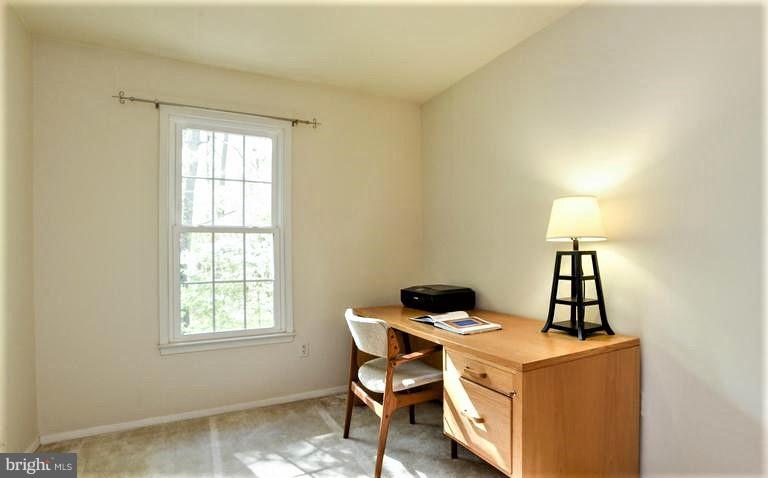 2406 Wanda Way Reston, VA 20191 - Photo 22 of 30 a dining room with a table and chairs