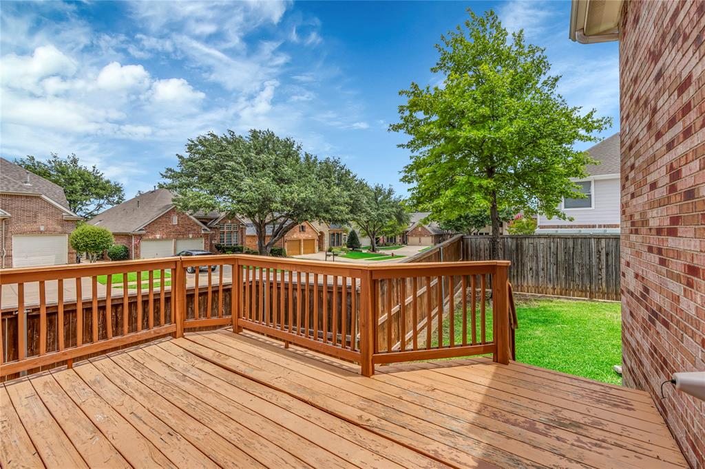 3920 Autumn Lane Bedford, TX 76021 - Photo 33 of 36 Expansive wood deck with a full railing, providing outdoor living space