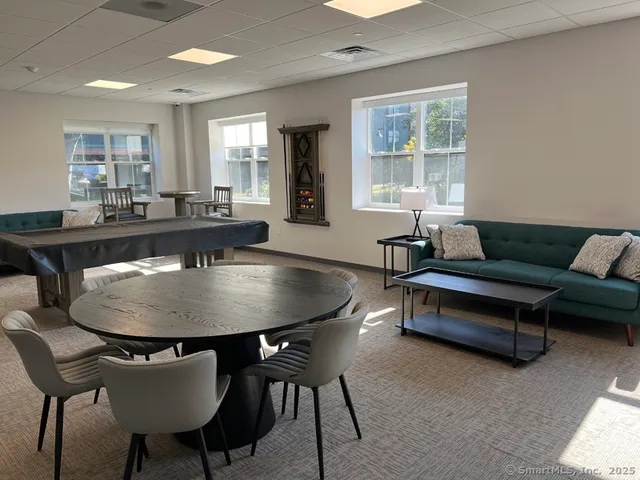 a living room with furniture and a table