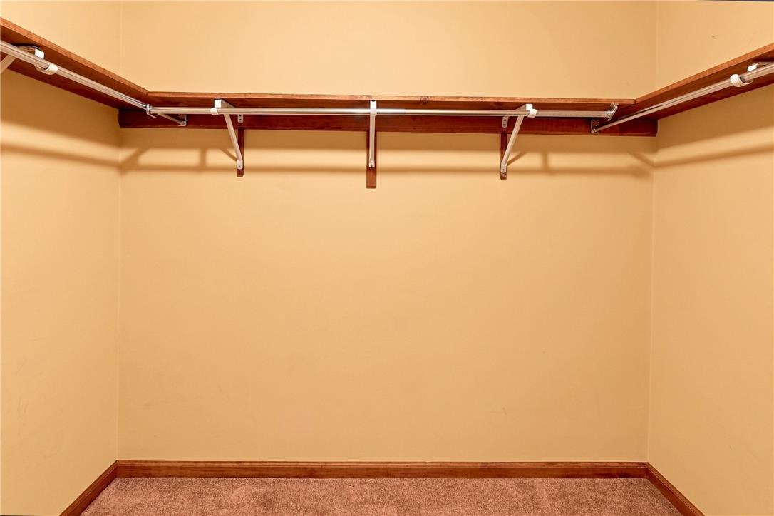 6090 Stone Post Road Bath, PA 18014 - Photo 29 of 57 Ample storage solutions define this practical and organized walk-in closet.