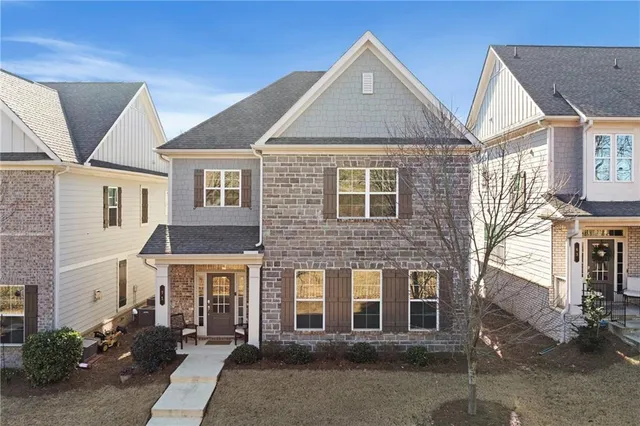 a front view of a house with a yard