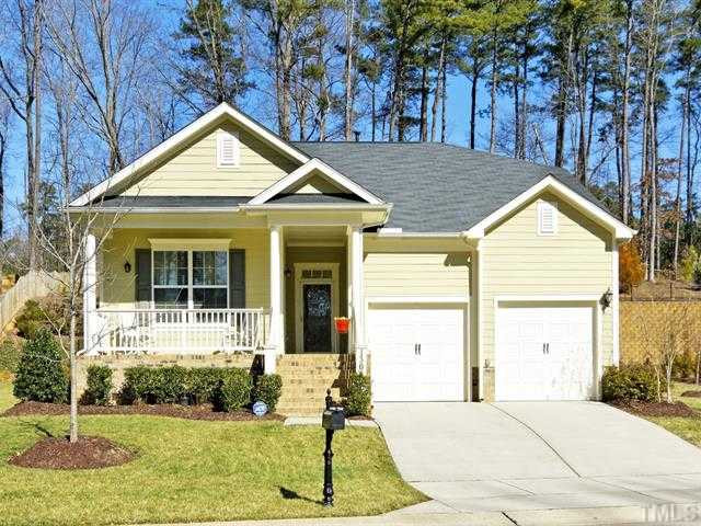 13006 Edsel Drive Raleigh, NC 27613 - Photo 1 of 25 Charming curb appeal with a rocking chair front porch and barn-style garage doors. Exterior Front