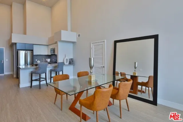 a dining room with furniture and wooden floor