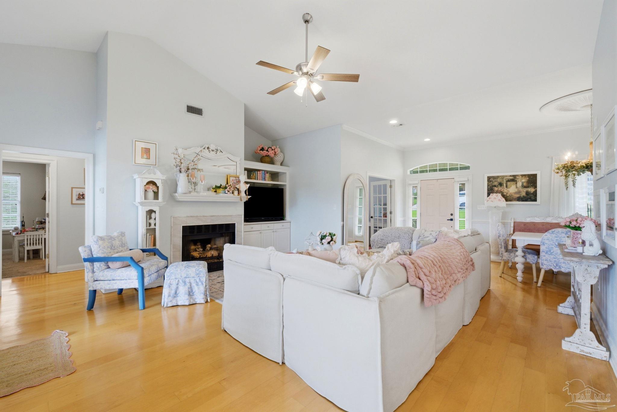 5931 Otter Point Road Pensacola, FL 32504 - Photo 14 of 67 a living room with furniture and a fireplace