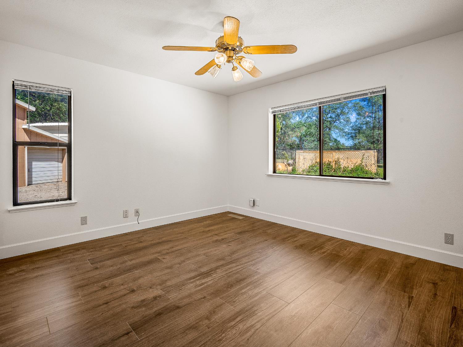 6460 Claim Street Placerville, CA 95667 - Photo 33 of 86 a view of an empty room with window and wooden floor